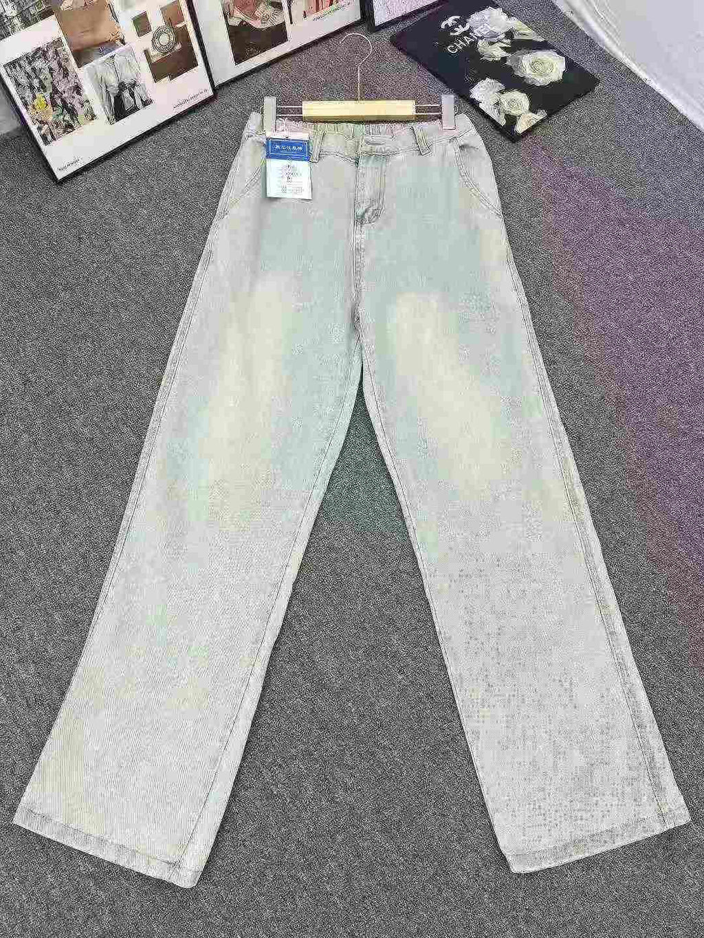 Women's washed stretch waistband jeans with a hole in the bottom