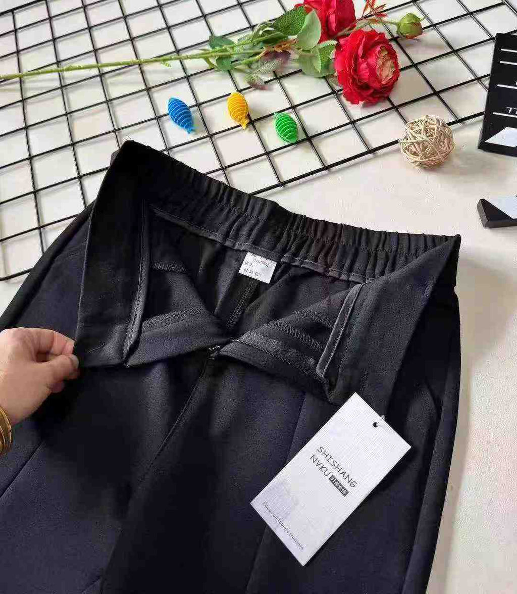 Women's high-waisted stretch black suit with slit and flared legs