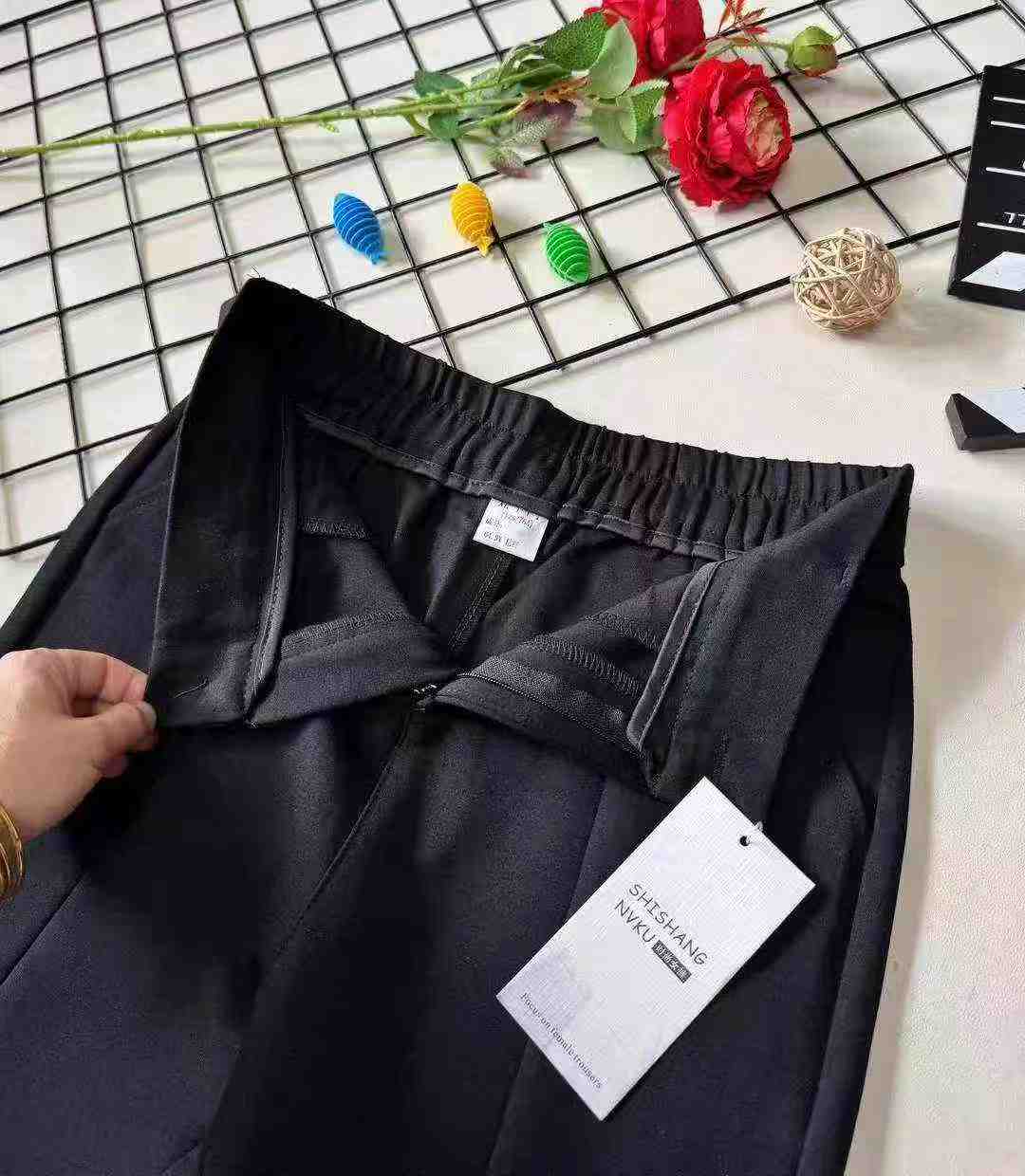 Women's high-waisted stretch black suit with slit and flared legs