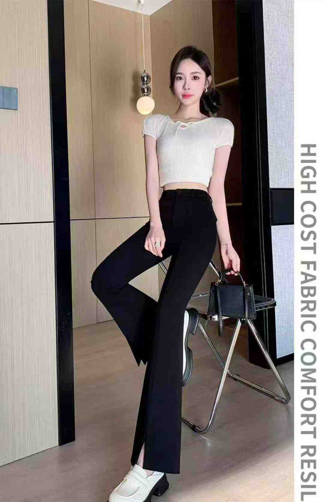 Women's high-waisted stretch black suit with slit and flared legs